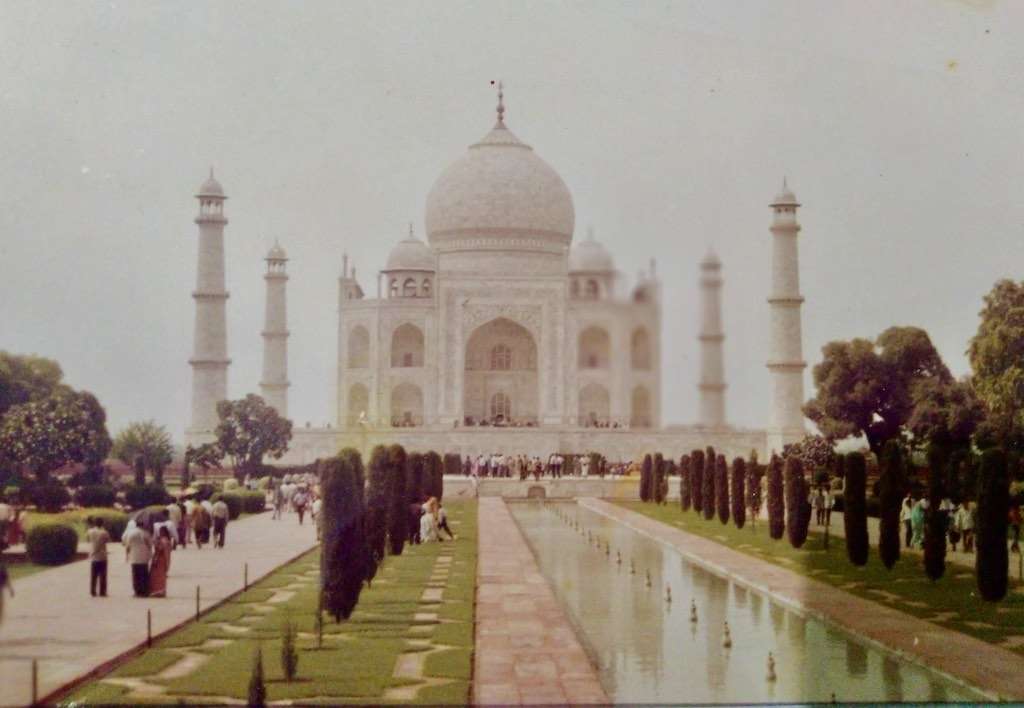 An old photograph of the Taj Mahal with the fountain beds filled with water
